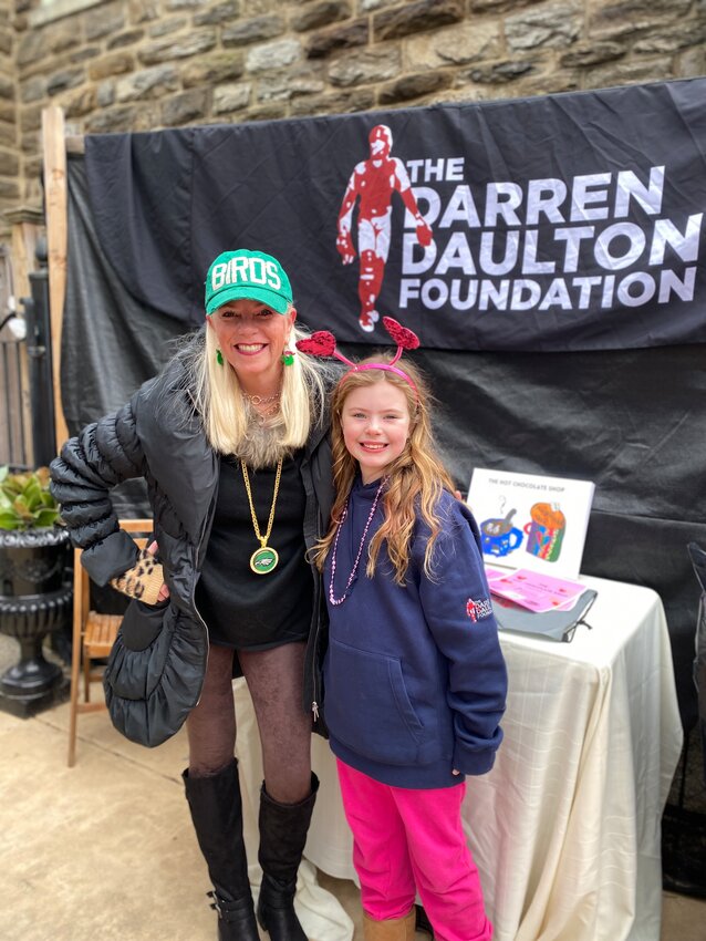 Cindy Webster (left), a consultant with the Darren Daulton Foundation, helped connect 8-year-old Betsy (right) and her family to the nonprofit which assists families who have a loved one fighting brain cancer.