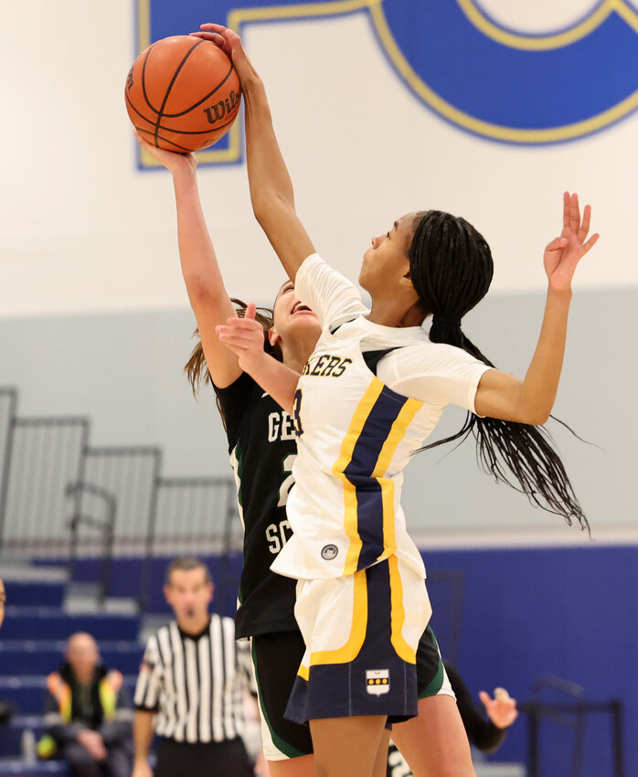 Penn Charter sophomore Laila Sharp (right) blocks a shot by Maya Ravindranathan of George School.