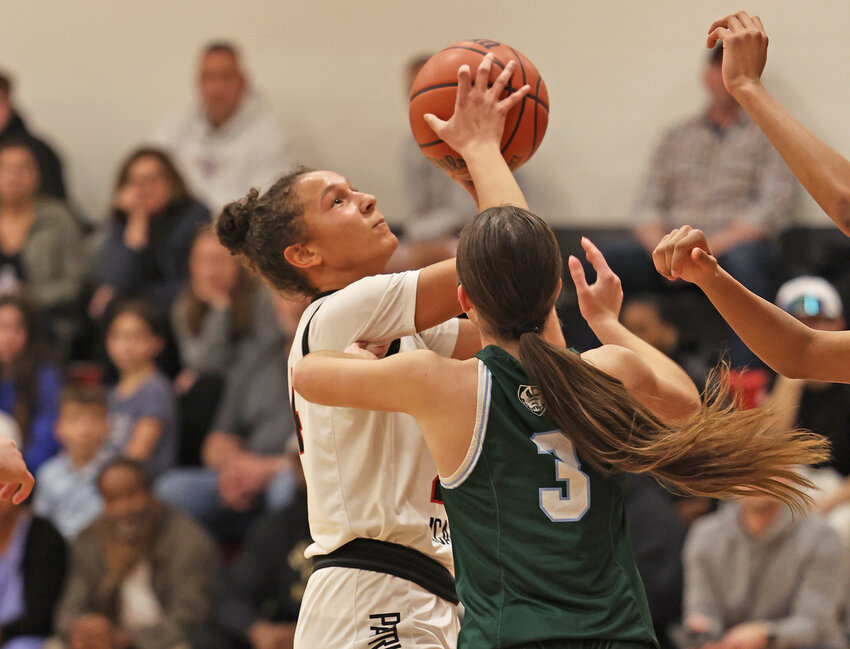GA sophomore Claire McKee eyes the basket while guarded by Shipley's Anna Pascale.