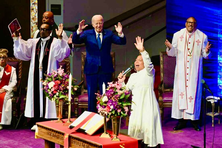 Former President Joe Biden (center) visited Bishop Ernest Carl Morris (right) last fall at the Mt. Airy Church of God in Christ.