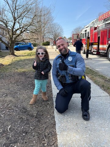 What began as a routine dog walk turned into an unexpected neighborhood rescue operation when Springfield resident Luke Angus and his 3-year-old daughter Lily spotted a neighbor and daughter gazing up at a cat stranded 75 feet high in a tree. They witnessed a dramatic rescue response from Springfield police (including the officer pictured above with Lily), and fire trucks from both Wyndmoor and Flourtown, with firefighters needing an extended ladder to reach the feline. &quot;Bar none, it was our most eventful dog walk!&quot; Angus said.