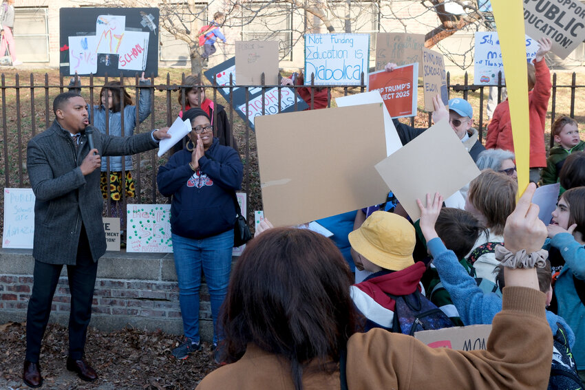 Dozens of Charles W. Henry School parents joined a nationwide protest Wednesday about the proposed elimination of the U.S. Department of Education.