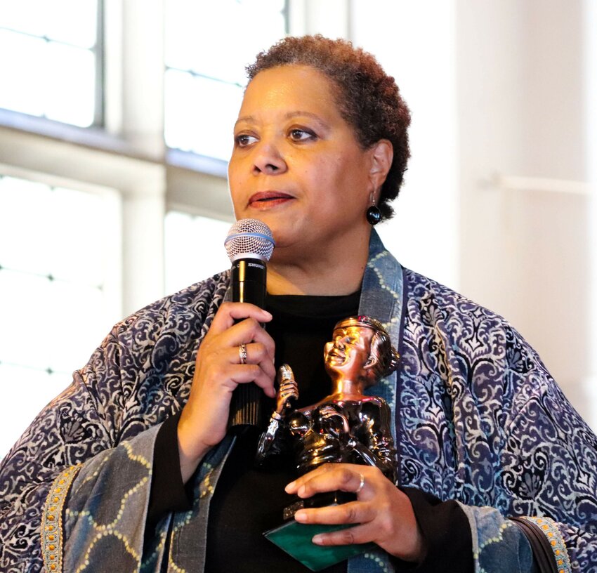 Kim Tucker holds an award/statuette presented April 2, 2019, at Canaan Baptist Church in Germantown.Tucker, along with Lovett Hines, received the awards &ldquo;for their dedication to the arts and the local music community.&rdquo;