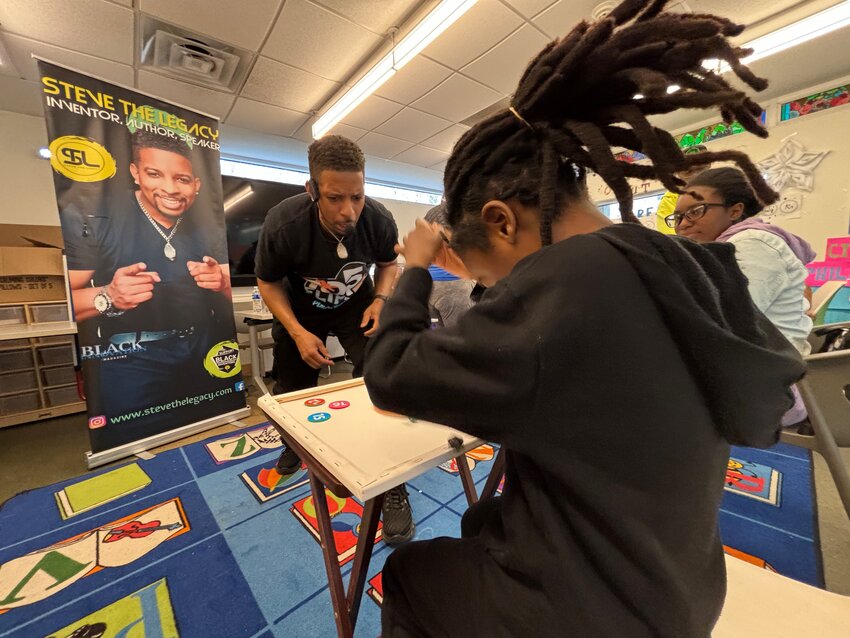 Stotts introduced his game, TOP 5, to kids at Lovett Library on March 31 in a tournament full of energy and excitement.
