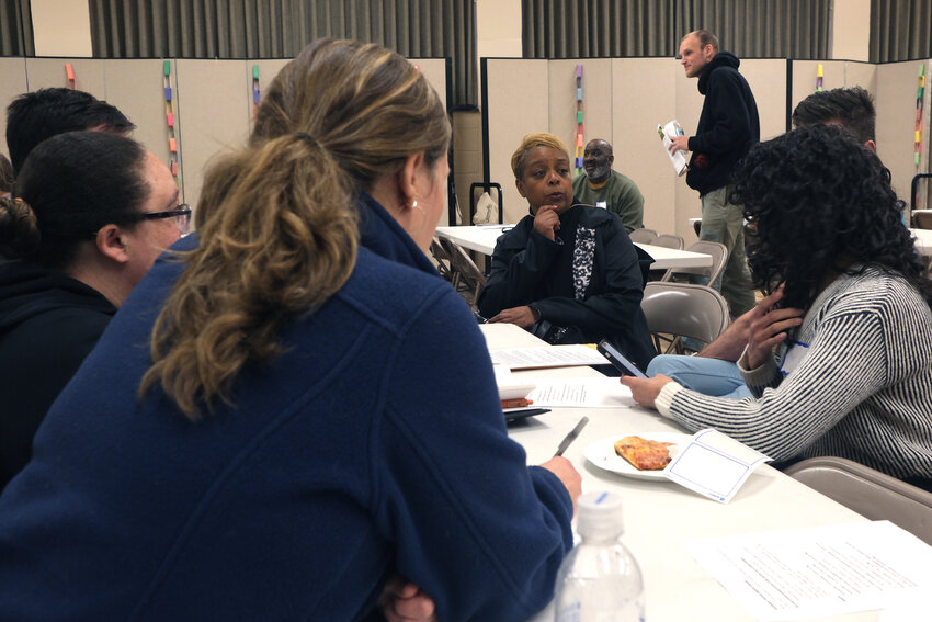 City Councilmember Cindy Bass, center, discusses the issues with participants at a Northwest Tenants meeting on April 7 in Germantown.&nbsp;