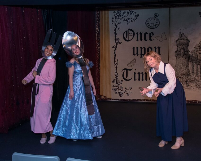 Sleeping Beauty (Alyssia Sims) and Cinderella (Kristen Spangenberg) torment Belle (Lisa Sims).