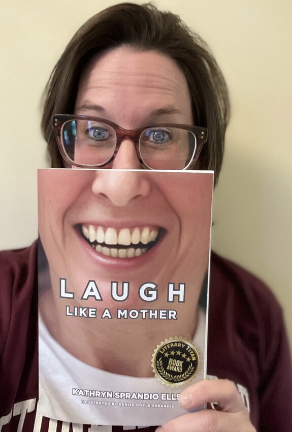 Sprandio Ells says self-publishing has allowed her to be creative with her book covers, which can be used as selfie props.