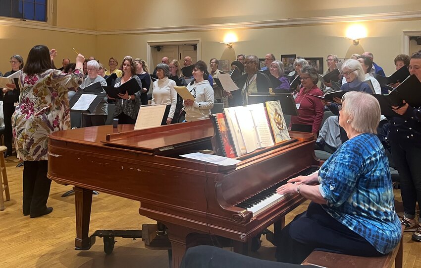 Gayle Wieand conducts Philomusica Chorale's rehearsals and performances in Germantown.