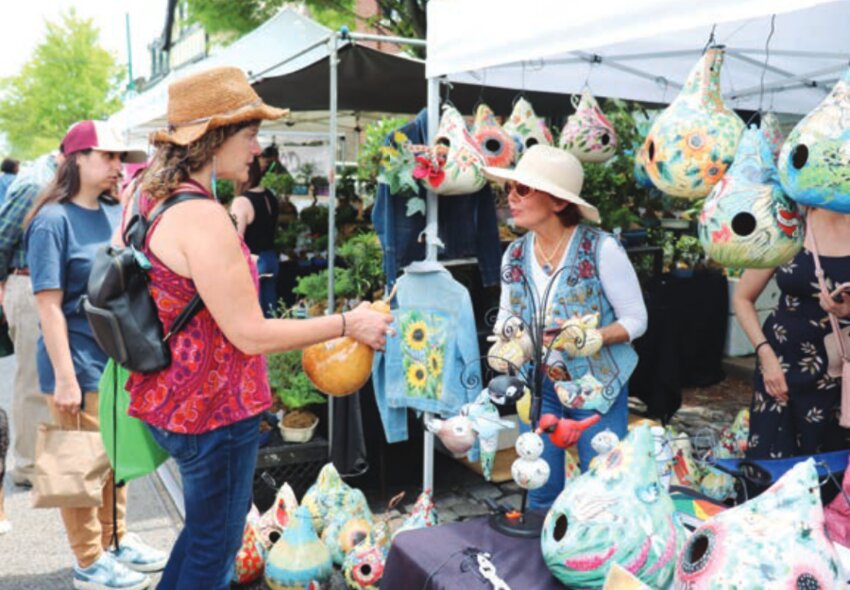 Festival-goers browse the many stands and vendors in Chestnut Hill.