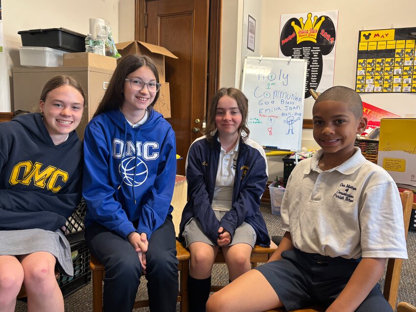 OMC students Grace Sprandio (seventh grade), Claudia Fisk and Cara Plover (eighth grade), and Johnny Matthew (fourth grade).