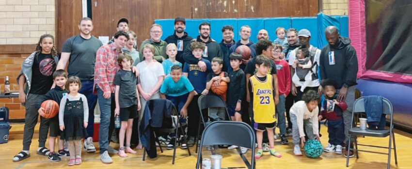 &quot;Dadball&quot; members run a &quot;Kidball&quot; program at the Germantown Life Enrichment Center, teaching kids basketball. Greg Anderson is pictured back row, fourth from left.