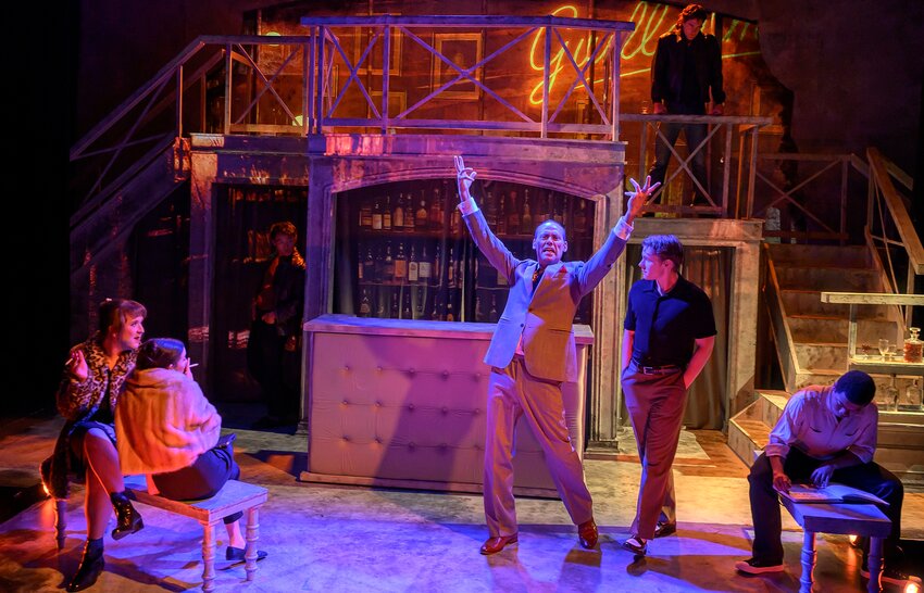 Dito van Reigersberg (center, arms raised) plays both Jacques and Dad in Quintessence Theatre Group's production of &ldquo;Giovanni&rsquo;s Room.&rdquo; (L to r: Midge Nease,  Anna Caccavaro, Patrick Zhang, van Reigersberg, Ethan Check, Anthony Costello and Rafi Mills).