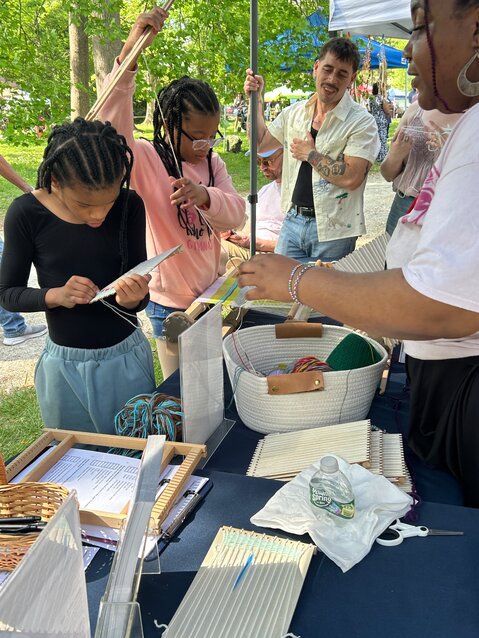 Local students participated in a community art weaving project with textile artist and Mt. Airy resident Richie Wilde Lopez at the Lantern booth at Mt. Airy Day, May 3.