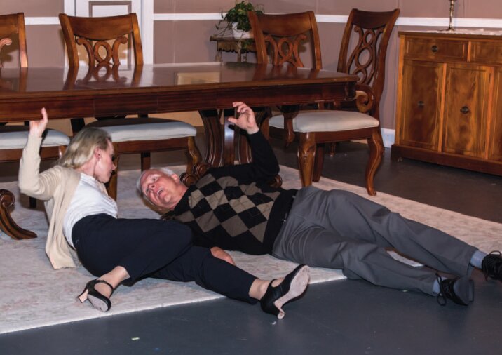 Actors Susan Matson and Norm Burnosky portray characters who are getting to know each other by discussing furniture repair in Old Academy Players' production of A.R. Gurney's &ldquo;The Dining Table.&rdquo;