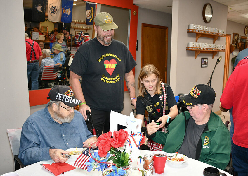 Serenity Honors thanks the veterans and hands out a keepsake bracelet.