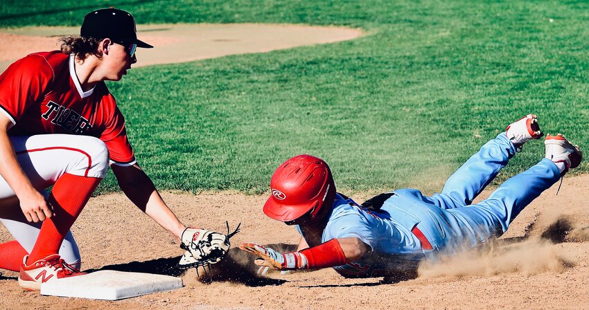 OZARK'S GEORGE REYNOLDS tags out a Glendale runner on a pick-off Wednesday.