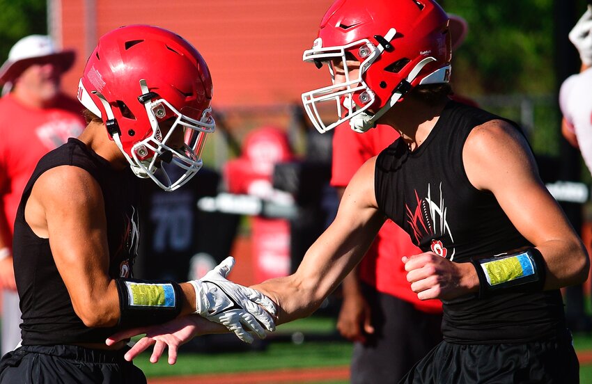 OZARK'S ANTHONY CORDELL AND PEYTON RUSSELL congratulate each other after teaming for a touchdown in 7-on-7 action.