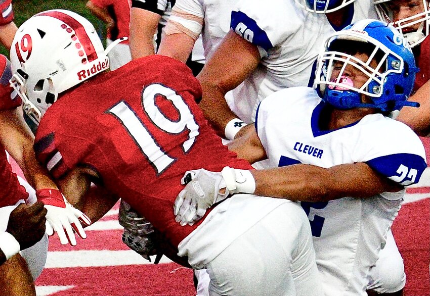 CLEVER'S MALACHI CRAWFORD keeps a Reeds Spring ball-carrier out of the end zone.