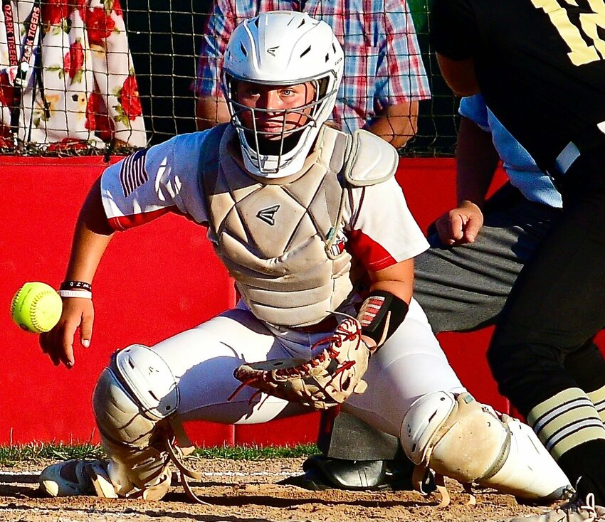 OZARK'S NATALIE MORGAN squares up her body to a pitch in the dirt.