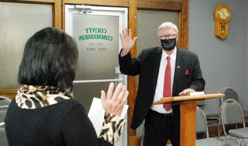 CHRISTIAN COUNTY EASTERN DISTRICT COMMISSIONER LYNN MORRIS (right) is sworn into office by Christian County Clerk Kay Brown (left) at a ceremony Dec. 31, 2020, in the commission&rsquo;s chambers at the Christian County Historic Courthouse in Ozark.&nbsp;