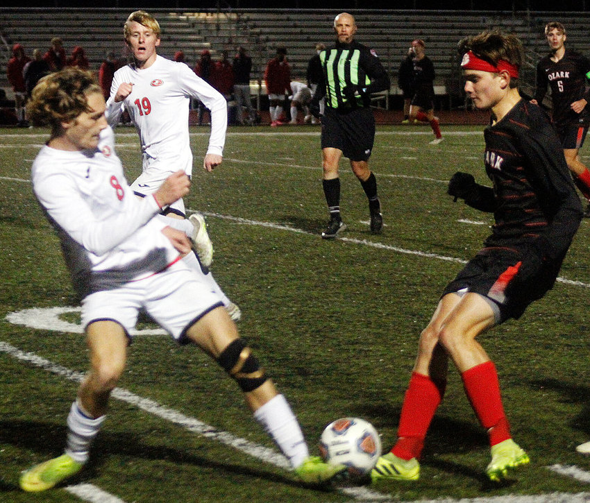 ETHAN PEEPLES and a Jefferson City player battle for possession of the ball Tuesday in Ozark's 2-1 Class 4 Quarterfinal loss.