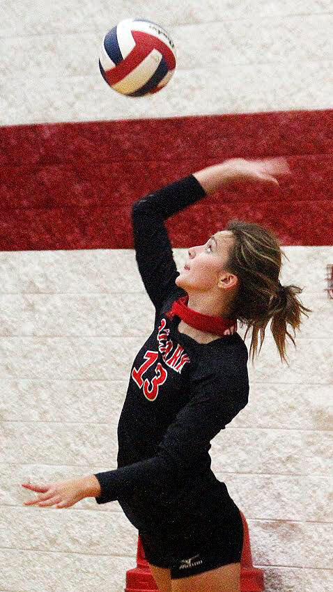 MADISON SATTERLY connects on a serve for Ozark during the Grand Slam Tournament on Saturday.