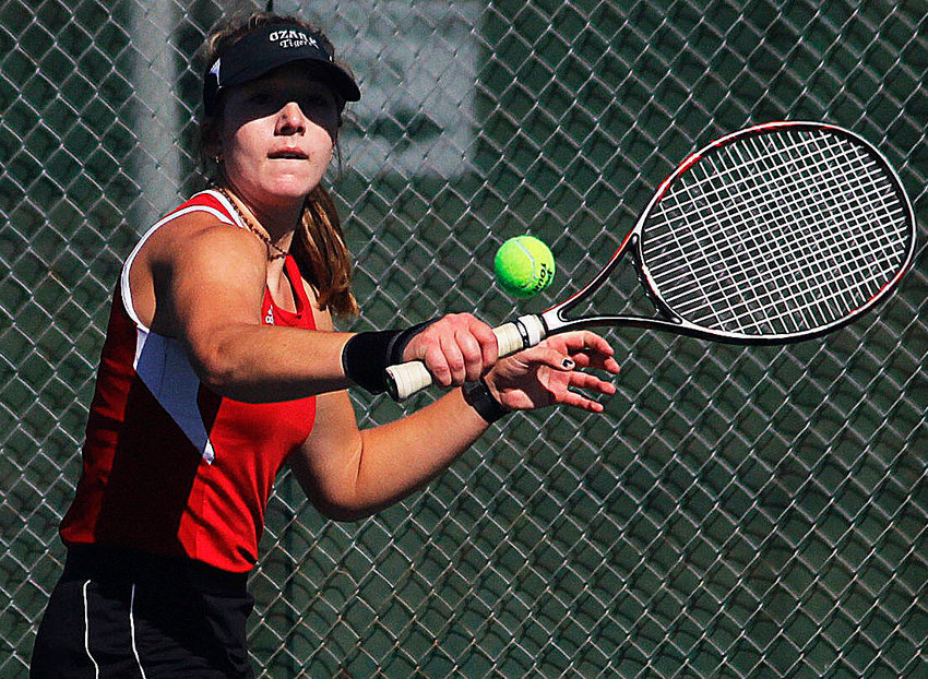 HANNAH METCALF makes a backhand return for Ozark at the COC Tournament.