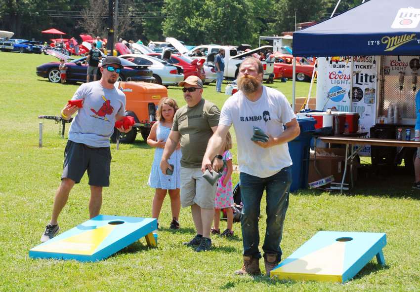 PLAYERS take part in the Signal Cornhole Tournament at the 2021 Sertoma Duck Race Festival on Saturday afternoon.
