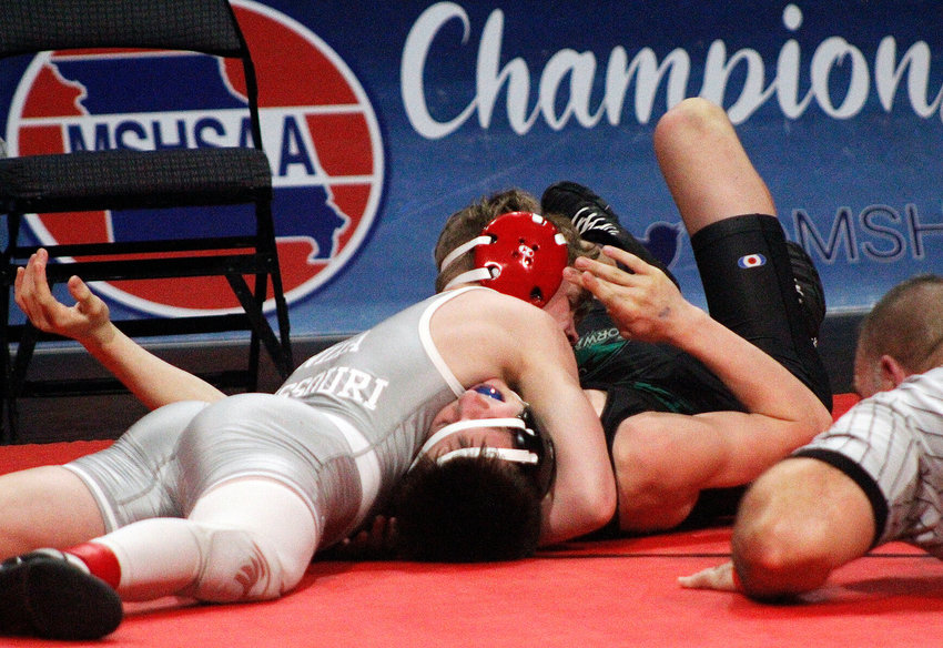 NIXA&rsquo;S ZAN FUGITT pins Staley&rsquo;s Logan Burks in the 113-pound championship match at the Class 4 State Tournament on Saturday.