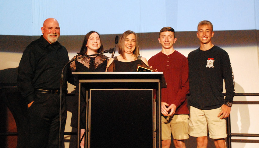 OZARK CITIZEN OF THE YEAR CYNTHIA GLENN (center) accepted her award from the Finley River Community Foundation with her family surrounding her at the Ozark Community Awards Banquet at The OC June 5, 2021.