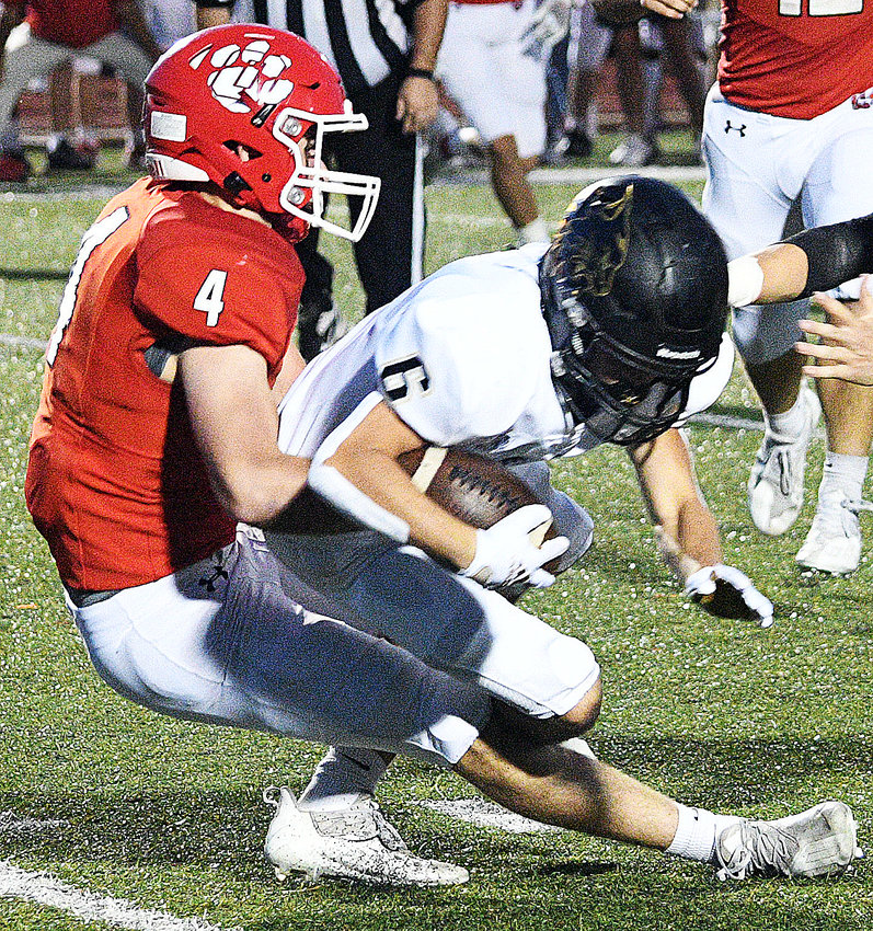 OZARK&rsquo;S COOPER BUVID records a tackle in the Tigers&rsquo; win versus Neosho last week.