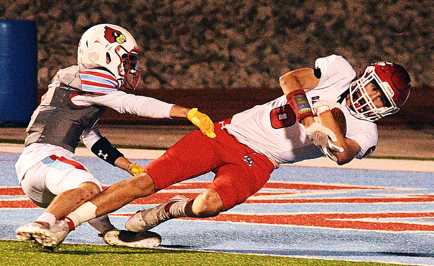 OZARK&rsquo;S JACE WHATLEY falls into the end zone for a touchdown at Webb City on Friday.