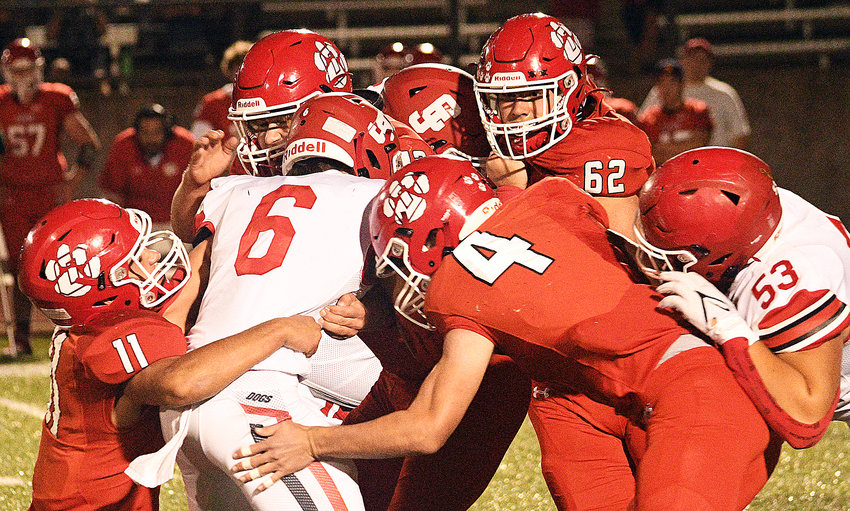 OZARK&rsquo;S GAGE DEPEE AND COOPER BUVID combine for a tackle versus Carl Junction on Friday.