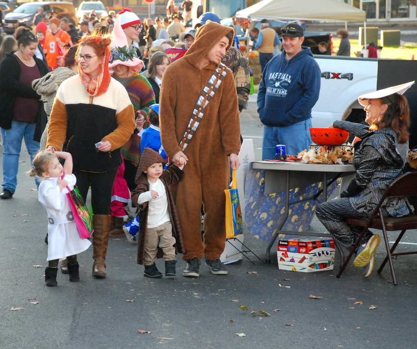 JEDI KNIGHTS, AN EWOK AND A WOOKIE were among the trick-or-treaters out to see the sights and get some candy during the Downtown Ozark Trunk or Treat on Oct. 31. See more Halloween photos from the square on Page 2.