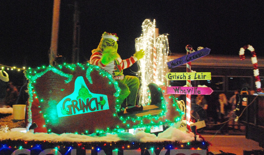 THE GRINCH, a cave-dwelling, ill-tempered creature from a Dr. Seuss book, rides aboard a parade float with some of Christian County&rsquo;s public officeholders from the Republican Party in the Sparta Christmas Parade on Dec. 4.