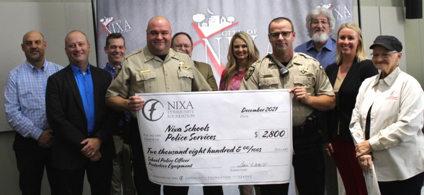 THE NIXA COMMUNITY FOUNDATION presented a grant for $2,800 to the school resources officers of Nixa Public Schools for the purchase of protective equipment in December 2021.