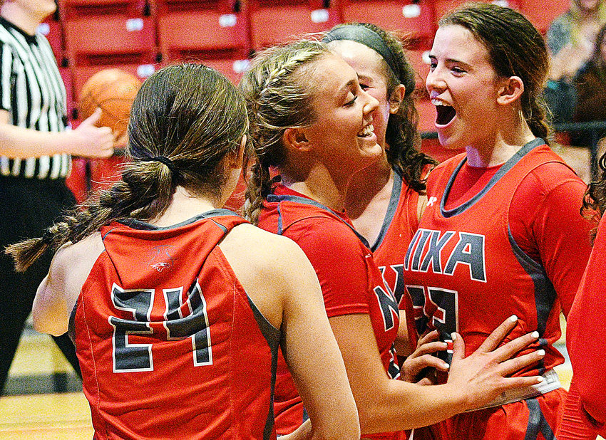 NIXA&rsquo;S ALI KAMIES receives congrats from teammates Rhi Gibbons and Kinley Hammitt after reaching the 1,000-point milestone in the Lady Eagles&rsquo; rout of Blue Eye on Tuesday.