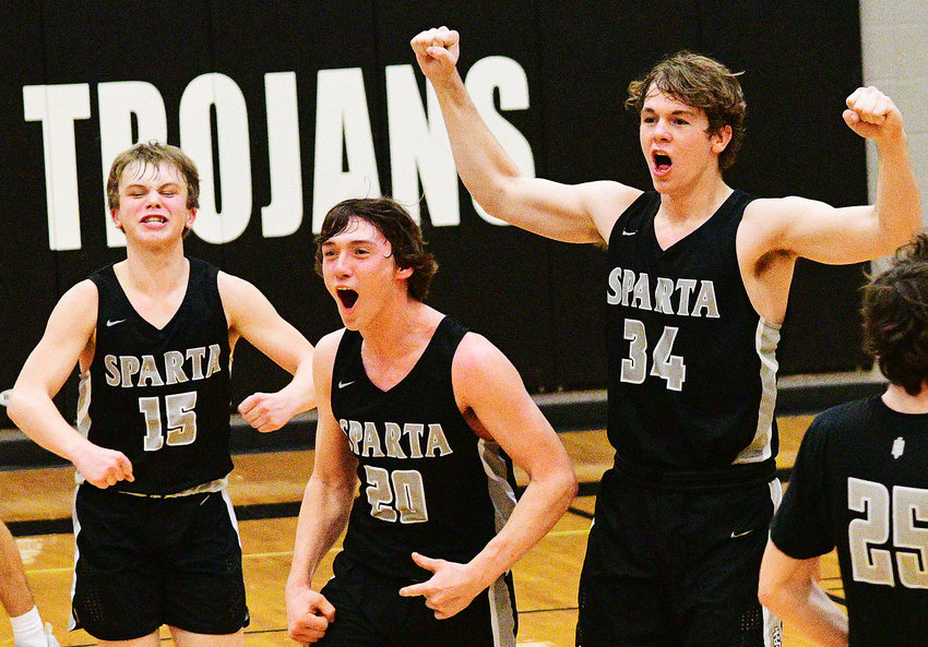 KAVON WALKER, STEVEN BROWN AND JACOB LAFFERTY celebrate Sparta&rsquo;s Class 3 District 11 semifinal win Tuesday.
