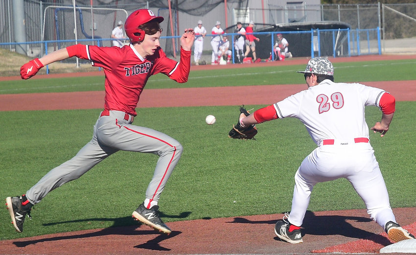OZARK&rsquo;S DEVYN WRIGHT tries to beat a throw to first base during jamboree action Sunday.