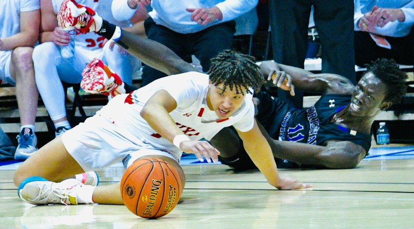 NIXA'S COLIN RUFFIN scrambles after a loose ball against Christian Brothers College on Friday.