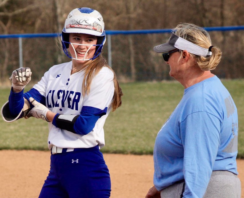 CLEVER'S KENNA WISE, left, receives congrats from her mother, Lady Jays assistant Angie Wise, following a base hit.