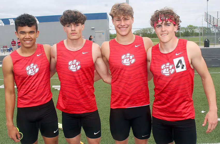OZARK&rsquo;S 4 x 200 RELAY of (l-r) Sam Clark, Ben Miller, Will Scheer and Hunter Johnson celebrate their first-place finish at the COC Meet.