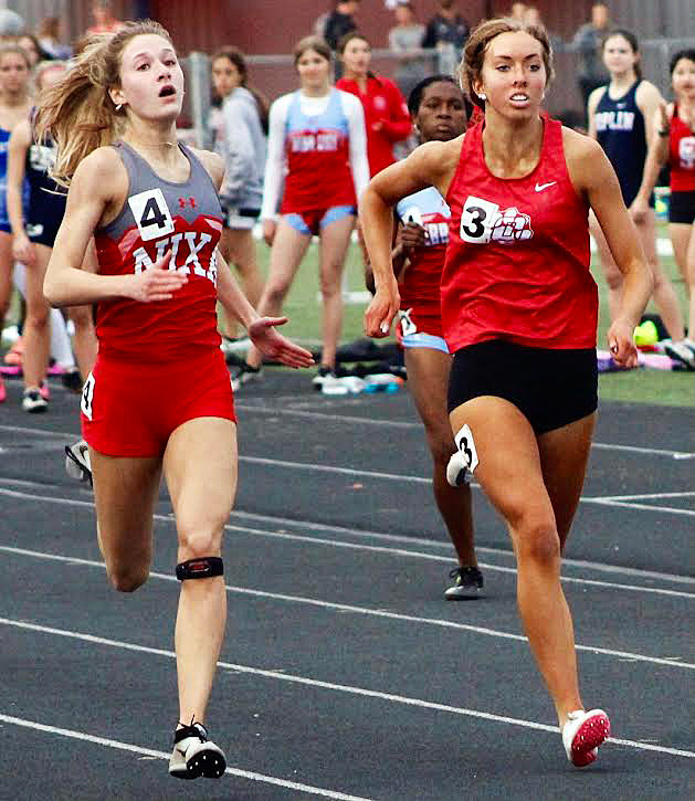 NIXA&rsquo;S TAYLOR HOPPER edges Ozark&rsquo;s Blaire Pace at the finish of the 400.