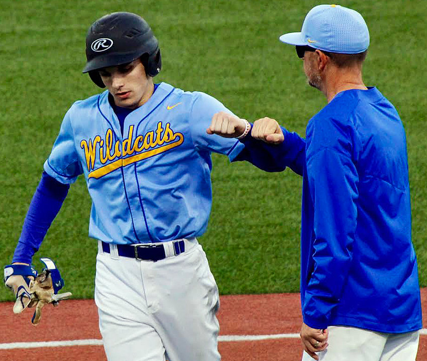 BILLINGS&rsquo; JASON SEKSCINSKI receives congrats from coach John Craig during the Wildcats&rsquo; Class 1 Quarterfinal loss on Wednesday.