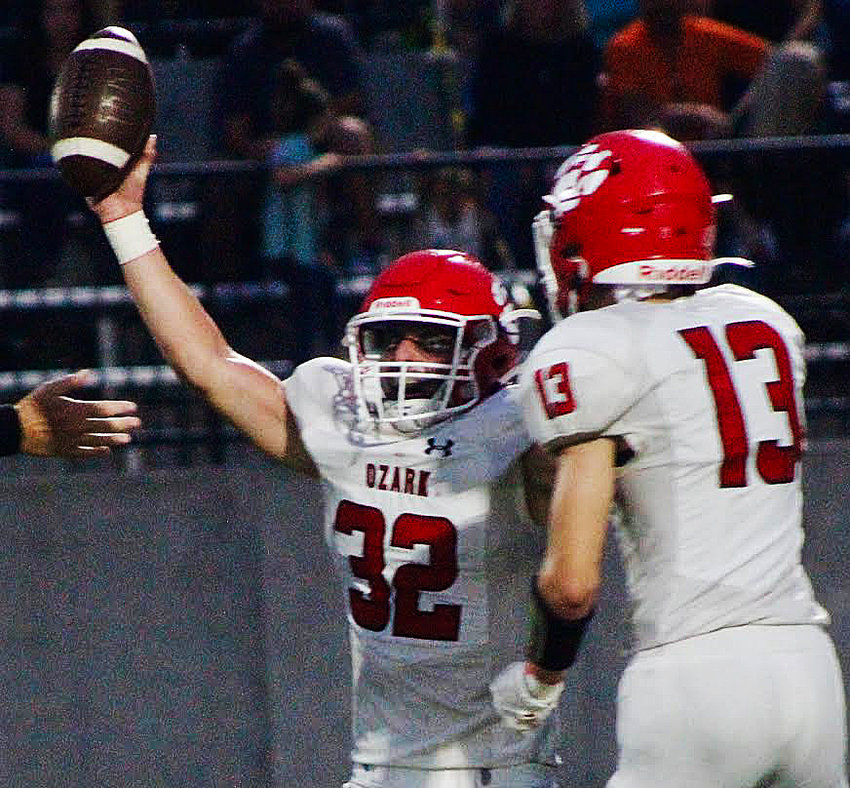 OZARK'S BROCK DODD celebrates a fumble recovery in Week Two at Republic.