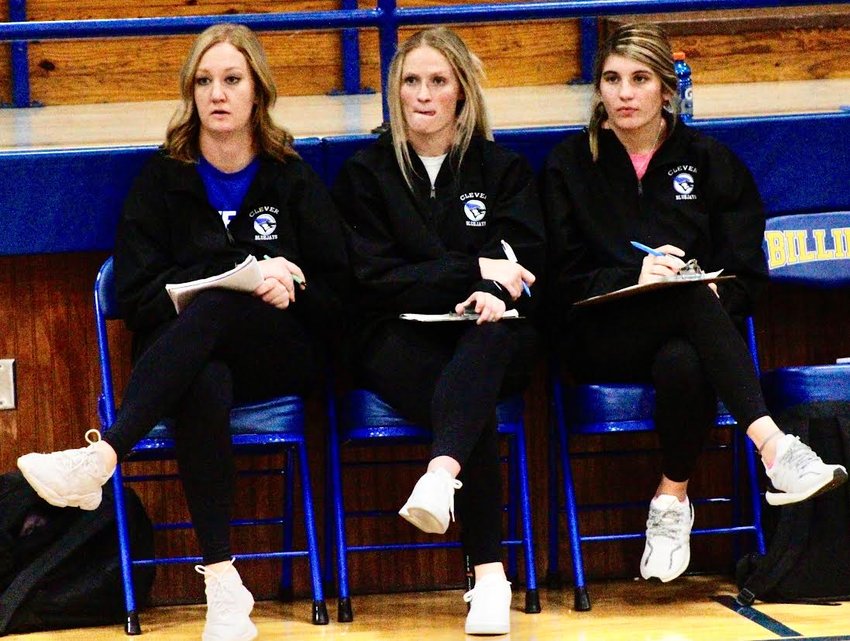 CLEVER COACH BRI WALSH, left, watches the Lady Jays in action at Billings last week alongside her assistants.