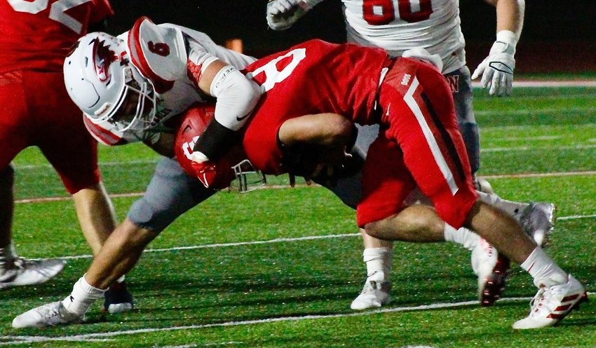 NIXA'S JAYDEN ANTONELLI collects a quarterback sack at Carl Junction on Friday.