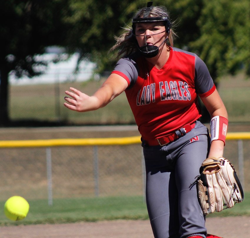NIXA'S MADDY MEIERER watches the flight of a pitch home at the Springfield Tournament over the weekend.
