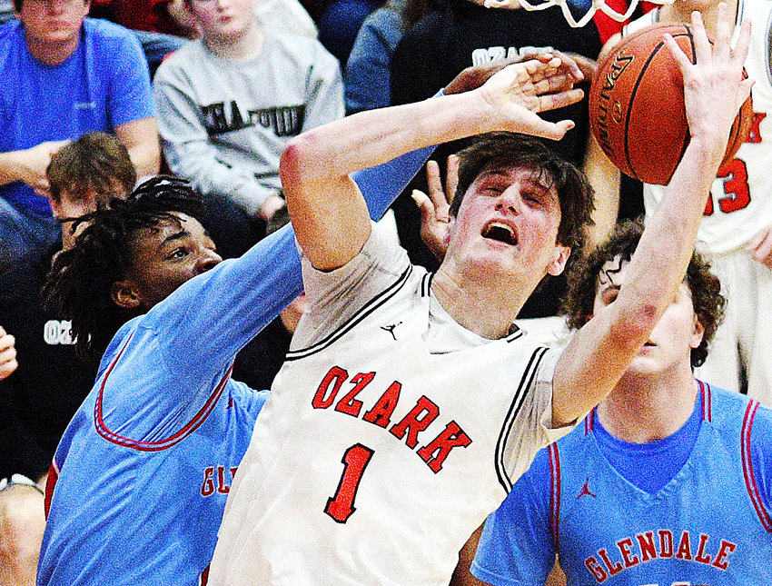 OZARK'S JACE WHATLEY fights for a rebound last year.