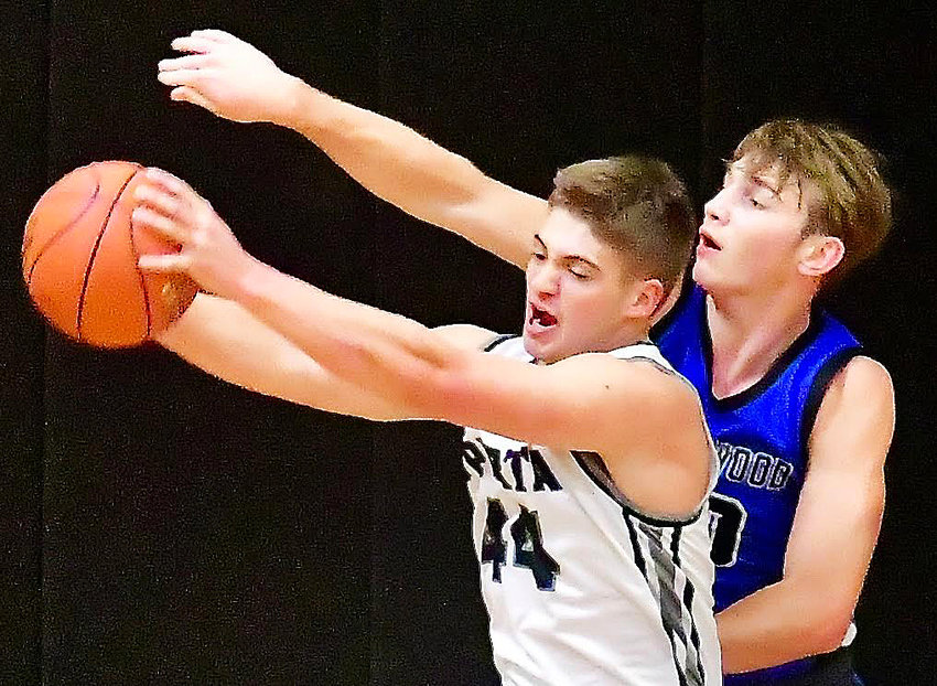 SPARTA'S DEXTER LOVELAND pulls down a rebound against Greenwood at the Sparta Tournament on Thursday.